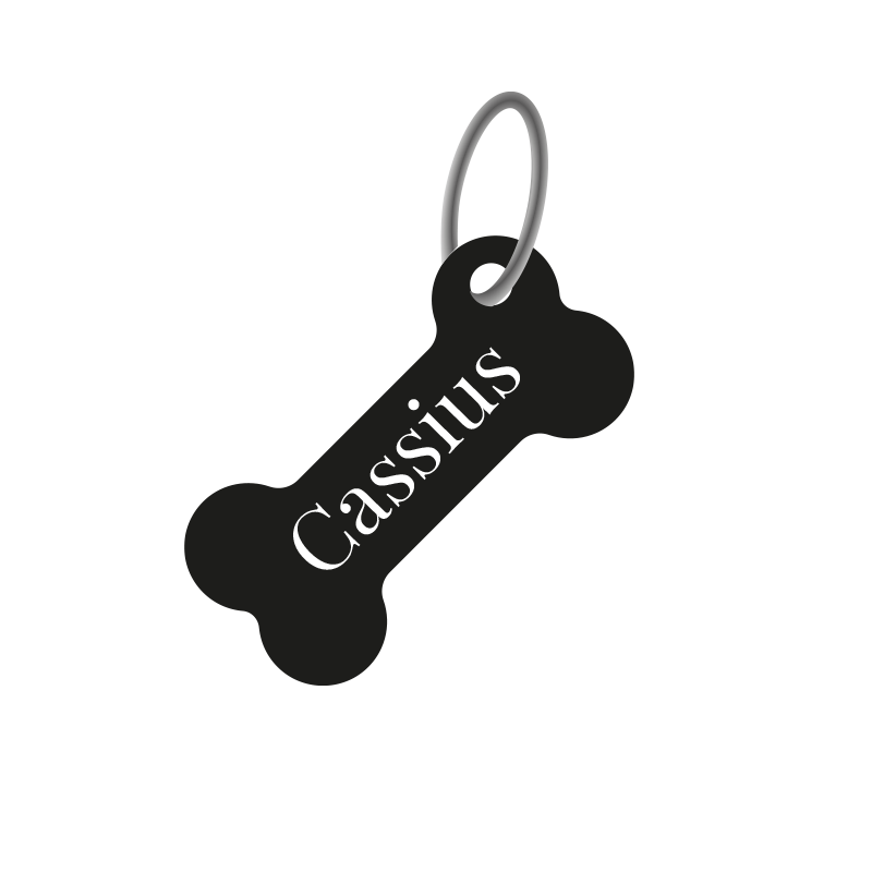 Exempel på en svart namnbricka i form av en benknota / ben med graverad vit text. Passar bra till hundhalsband.